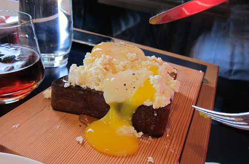 fried poached eggs on brioche with turkey