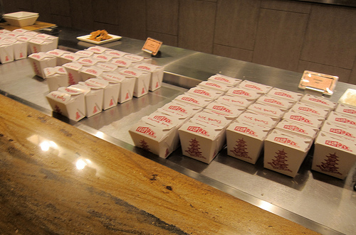 tiny take-out boxes of noodles and spare ribs