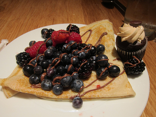 crepe with berries, a lot of them