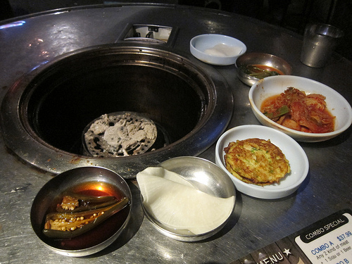 banchan around the charcoal grill