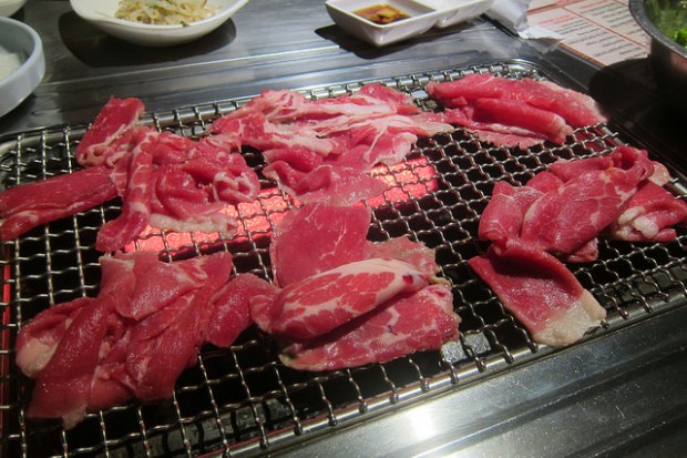 grilling a lot of beef