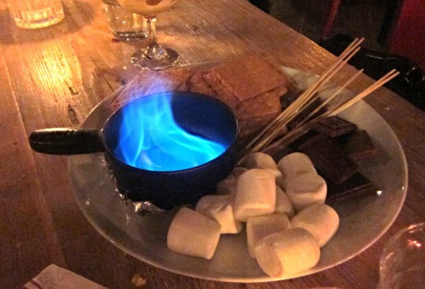 making s'mores at the table