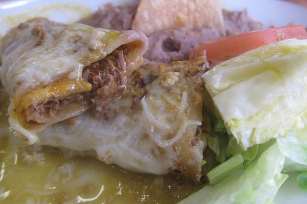 close up of the (beef) birria inside the burritos